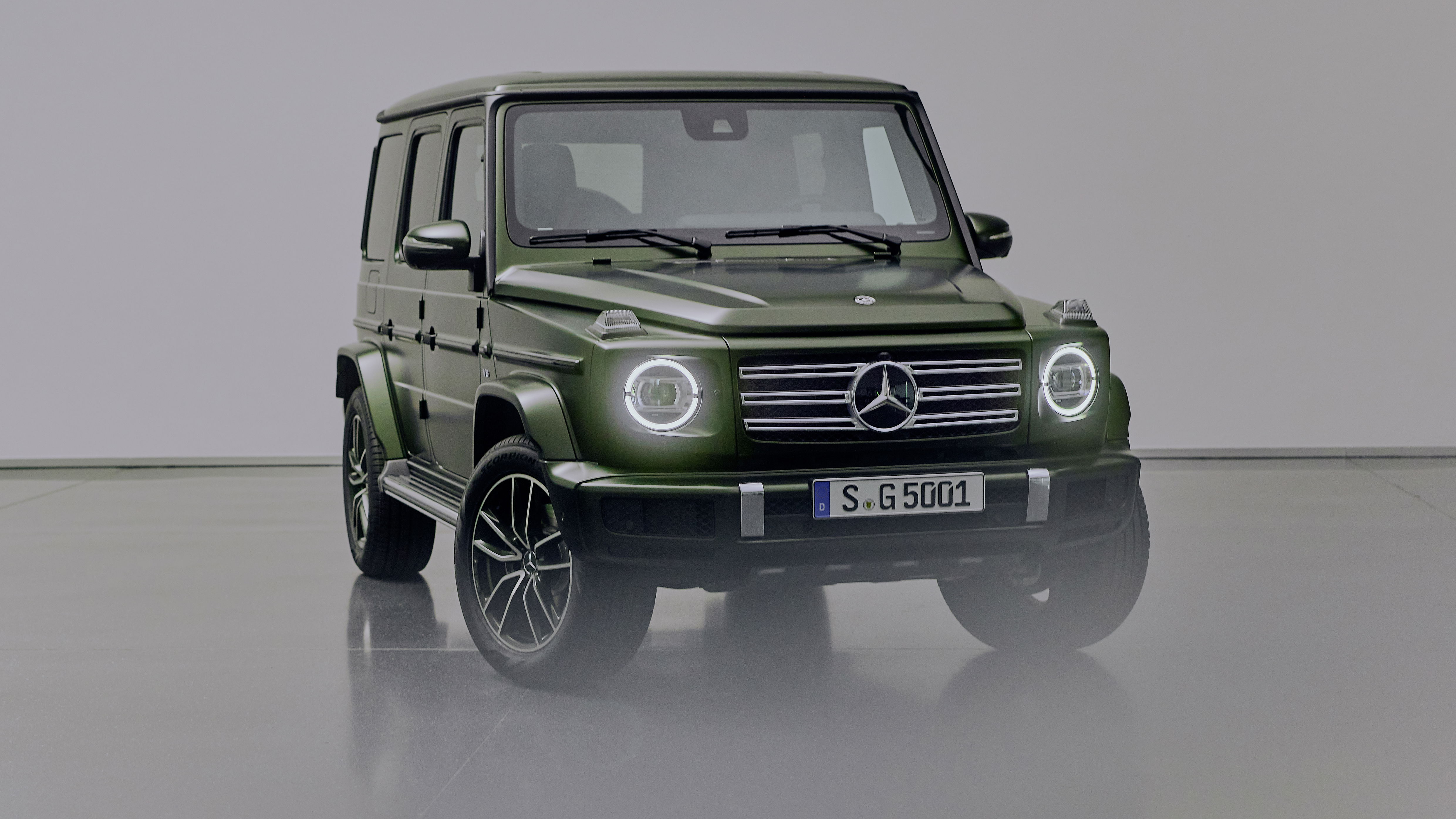 A green Mercedes-Benz G500 G-Class