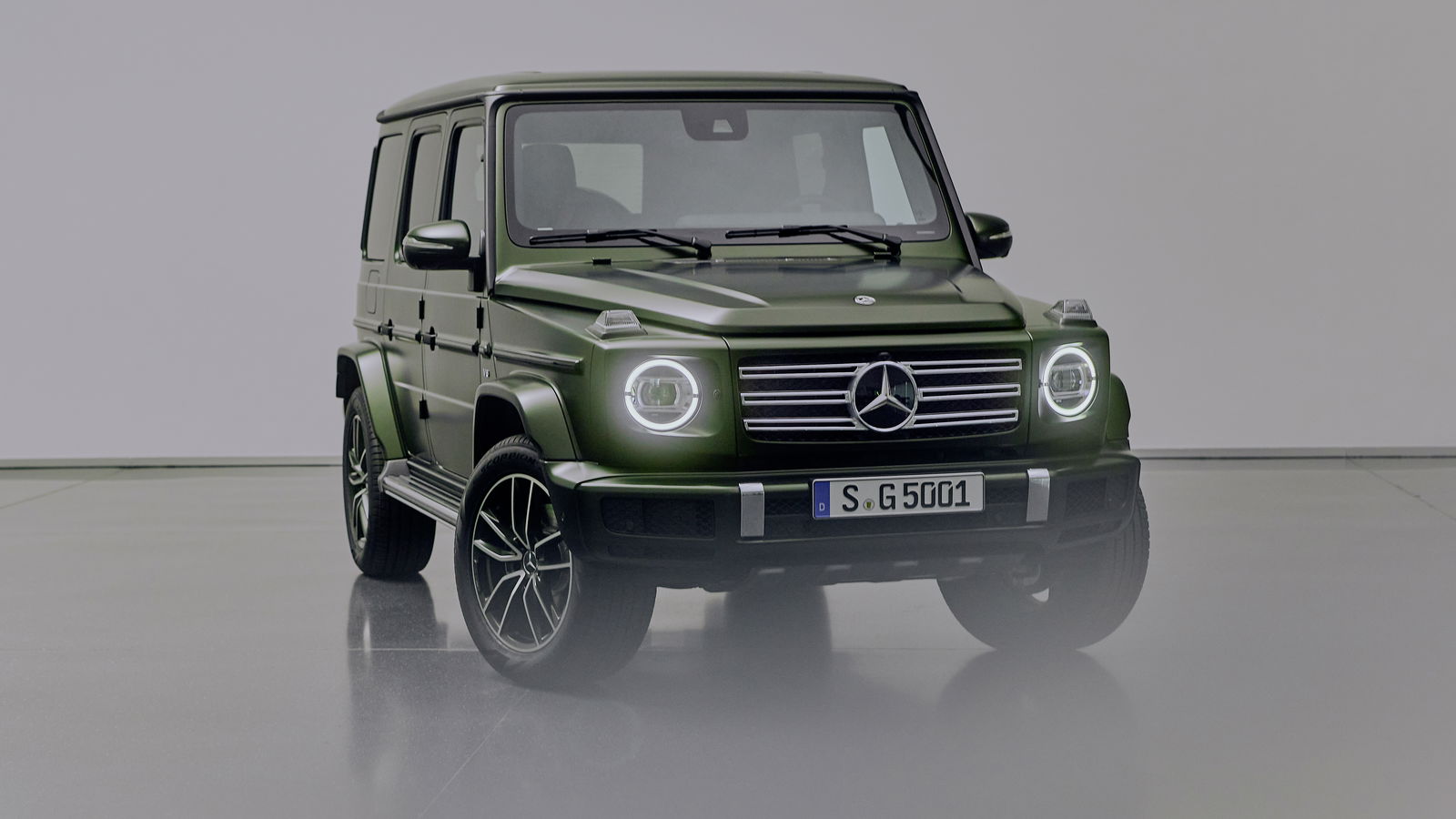 A green Mercedes-Benz G500 G-Class