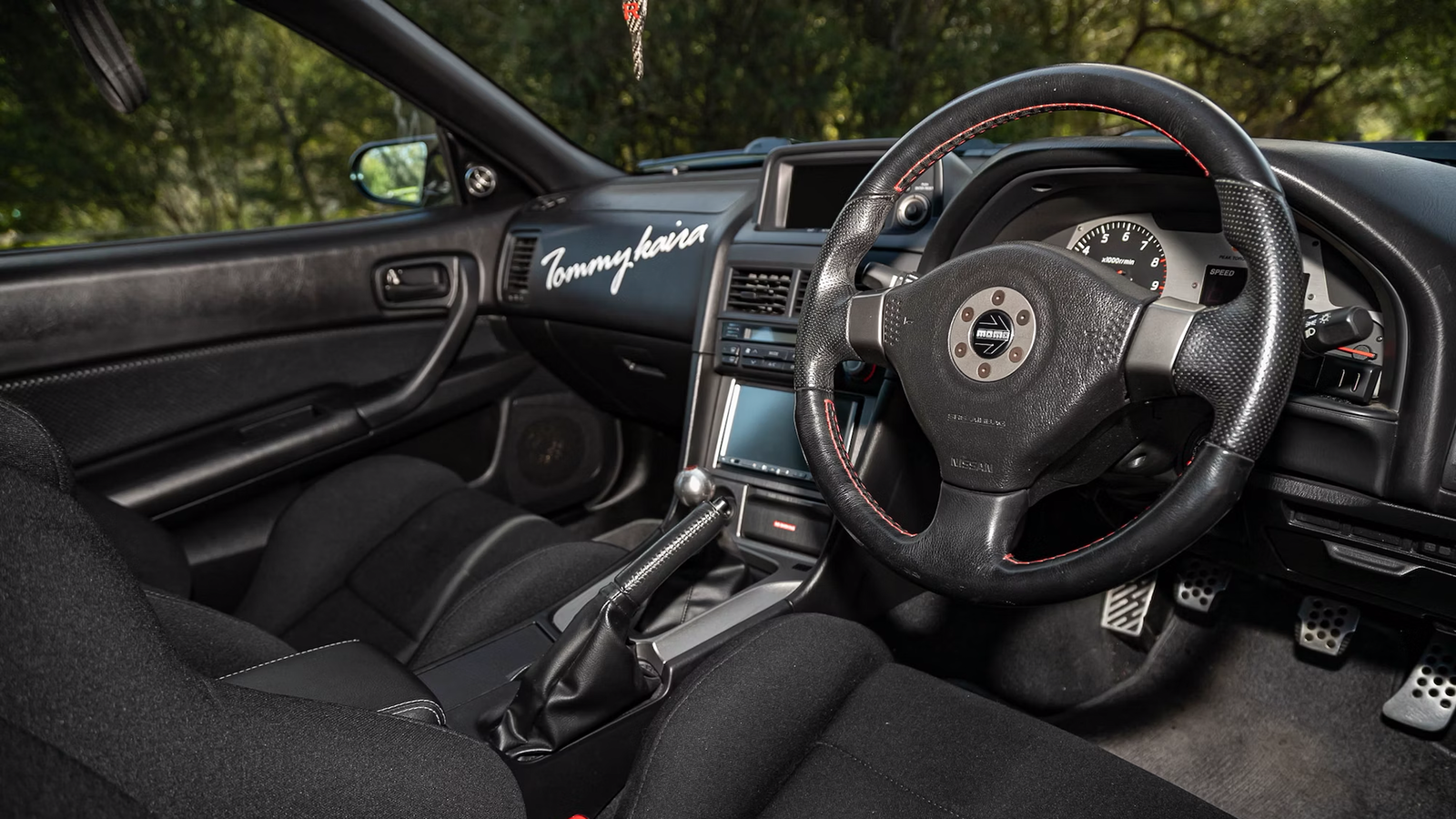 The interior is lightly fettled, including a Momo steering wheel