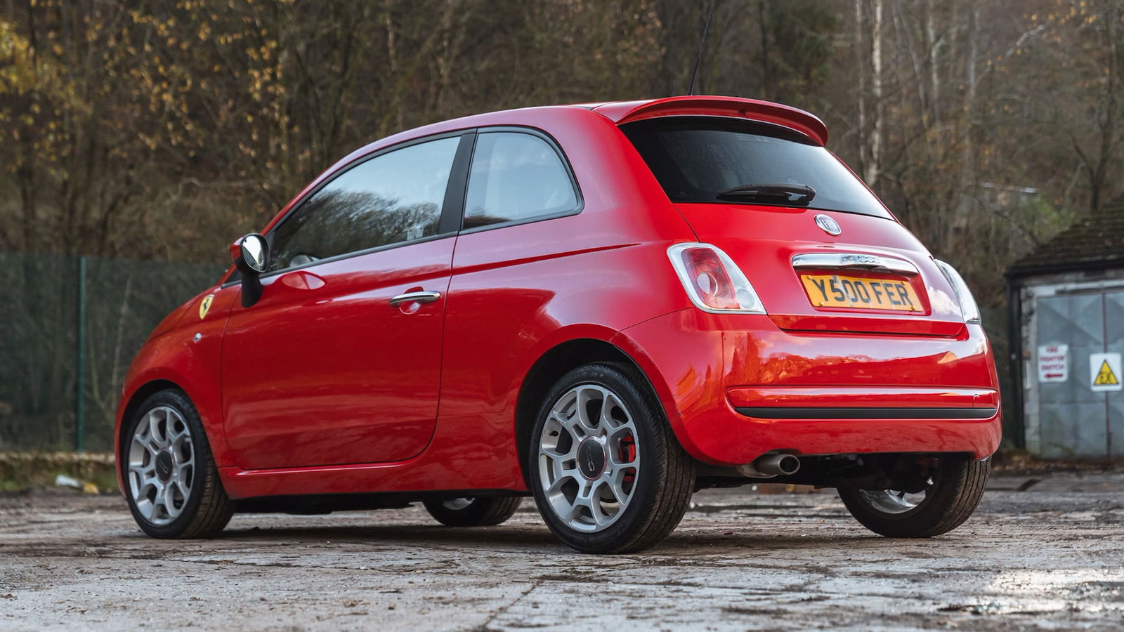 It's Rosso Corsa, and has Scuderia shields. Basically the real thing, then