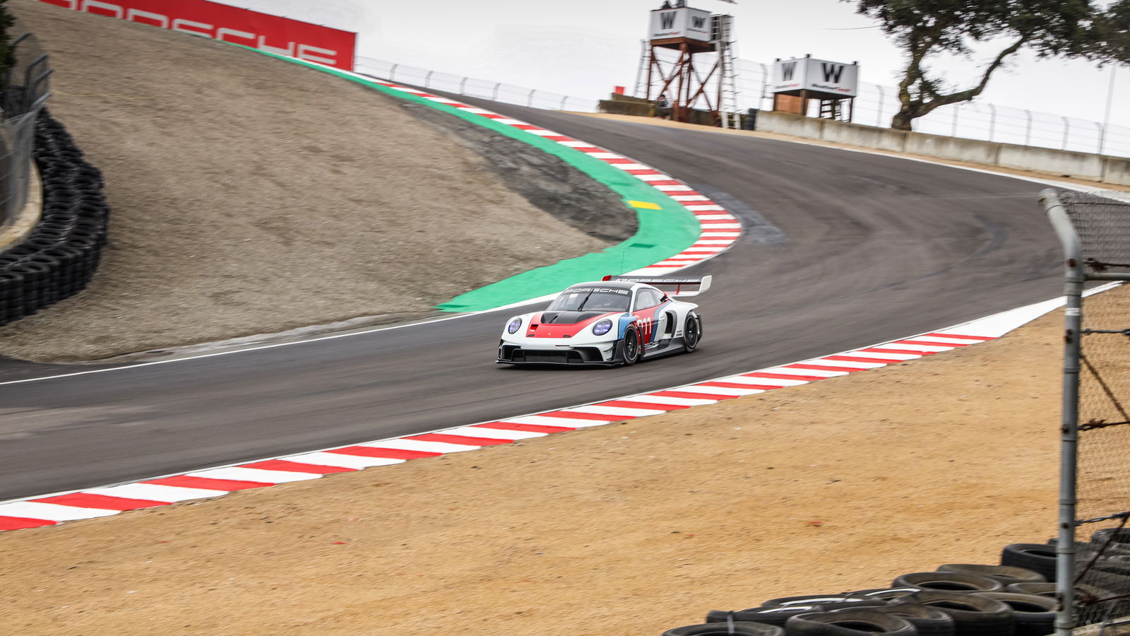 A Porsche 911 GT3 R rennsport tackles Laguna Seca's corkscrew