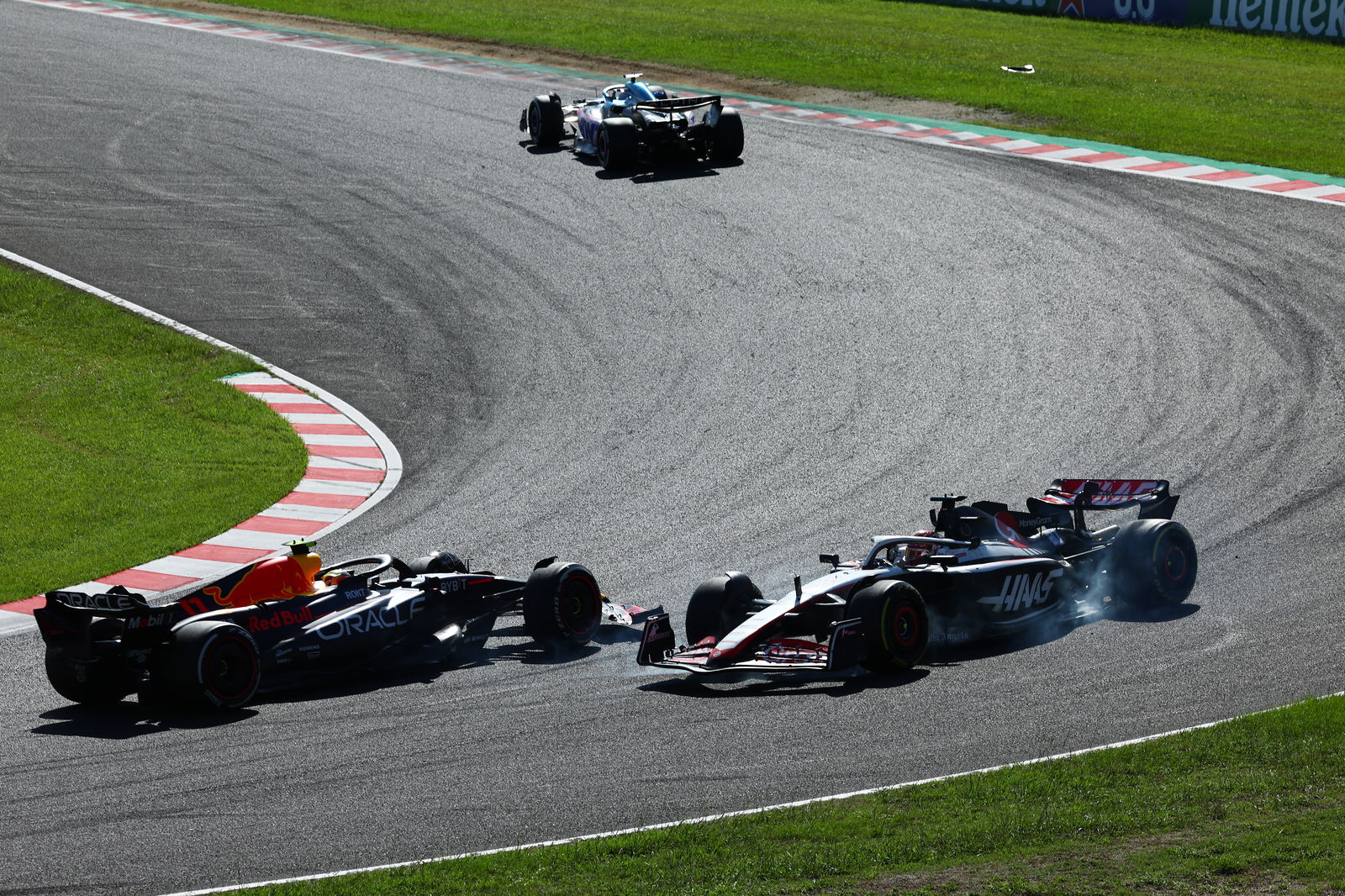 Sergio Perez and Kevin Magnussen after a collision 
