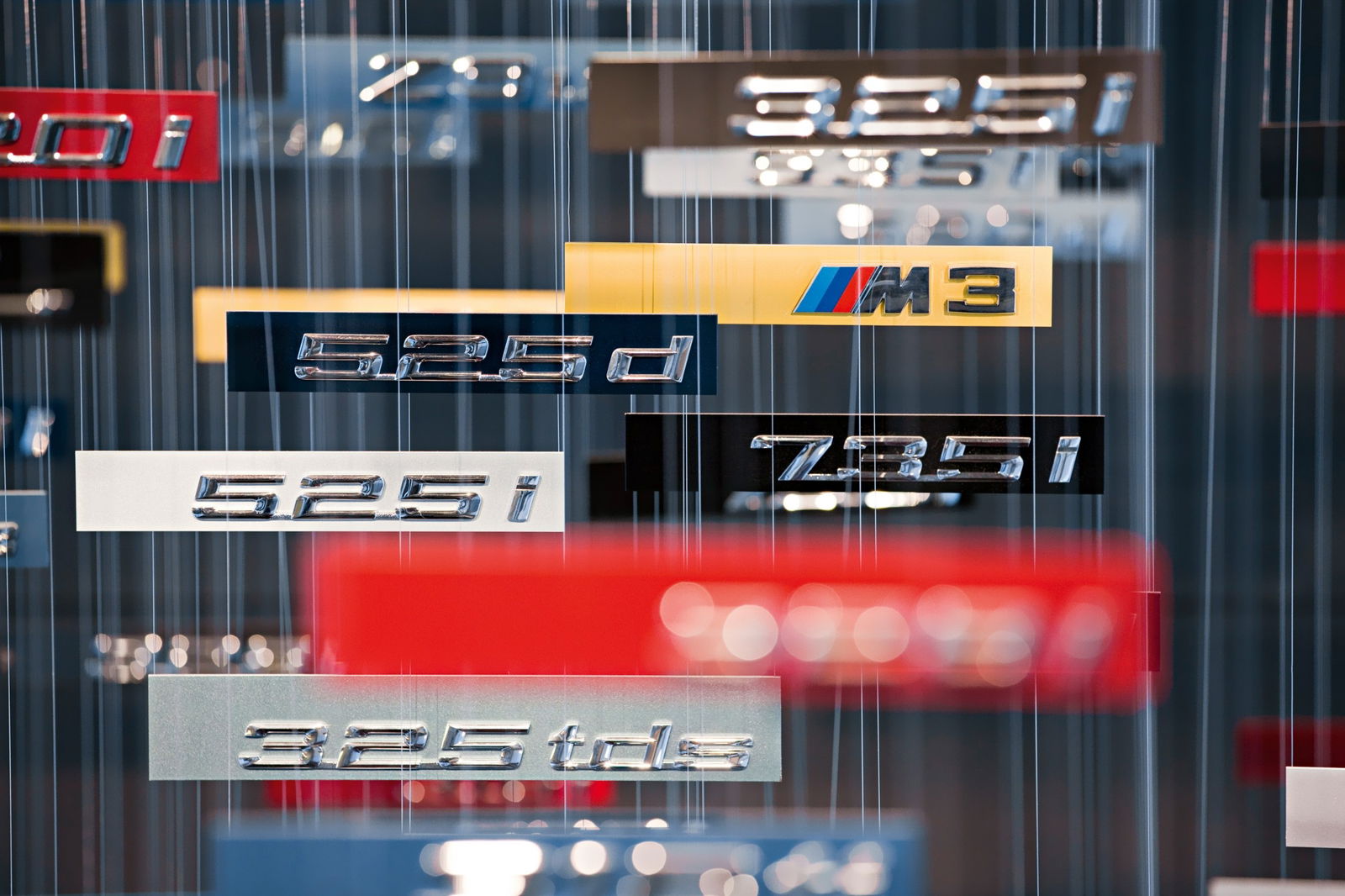 A collection of model name badges at the BMW Museum