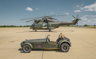 Caterham RAF 360 with Puma helicopter - side