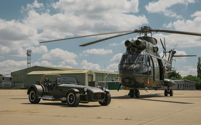 Caterham RAF 360 with Puma helicopter - front