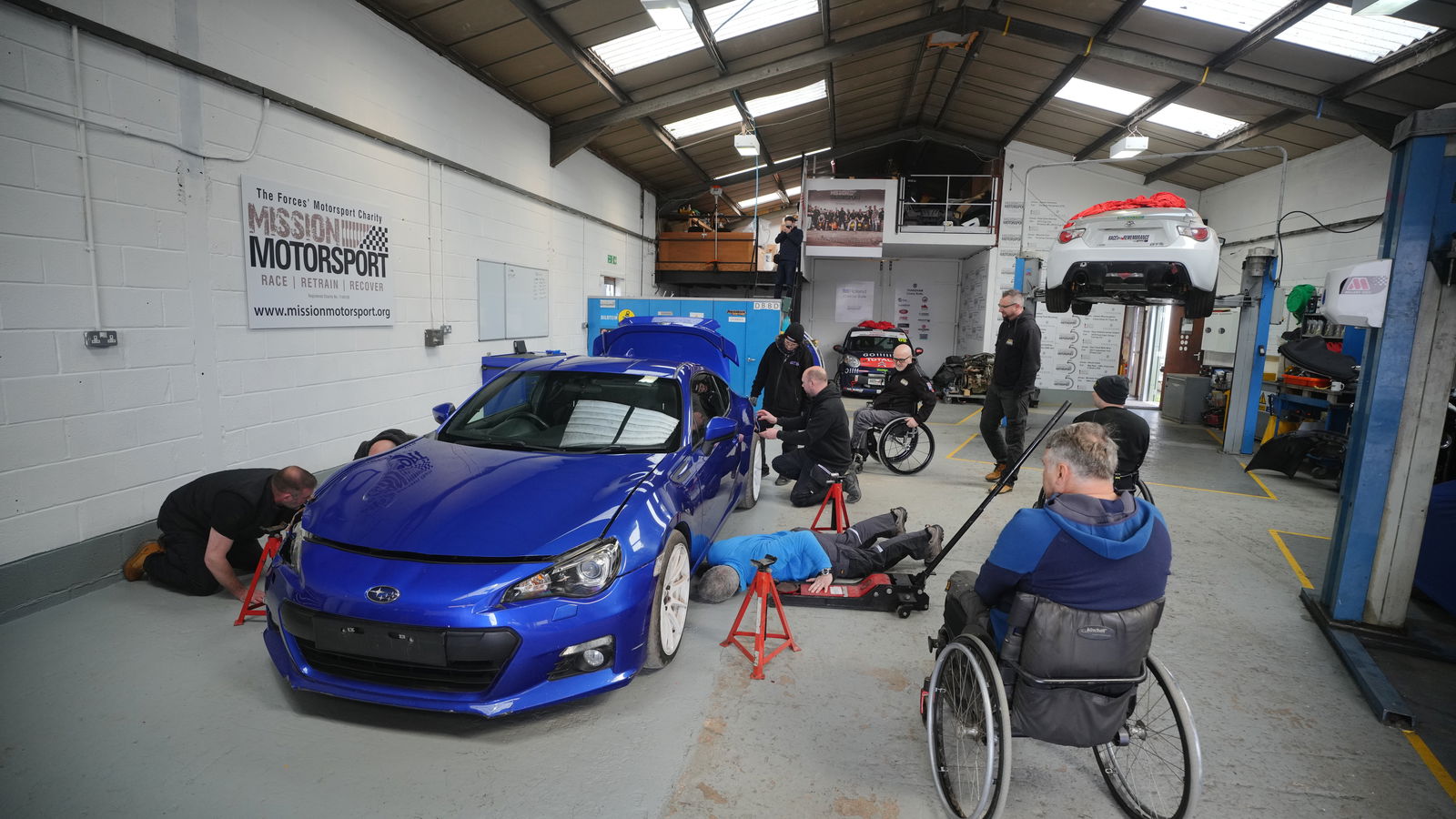The Mission Motorsport team working on the BRZ