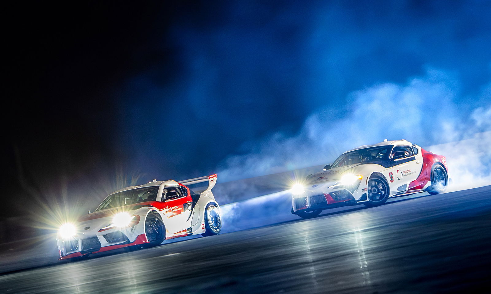 Two autonomous Toyota GR Supras drifting