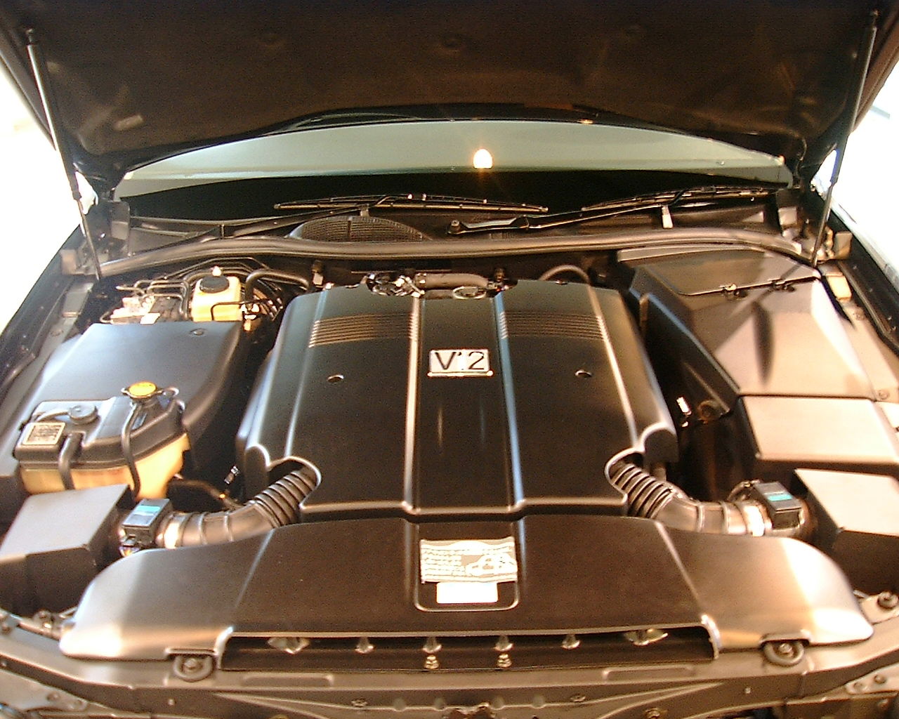 Thanks to a dreadful plastic cover, the 1GZ doesn't look like much when you pop the Century's hood 
