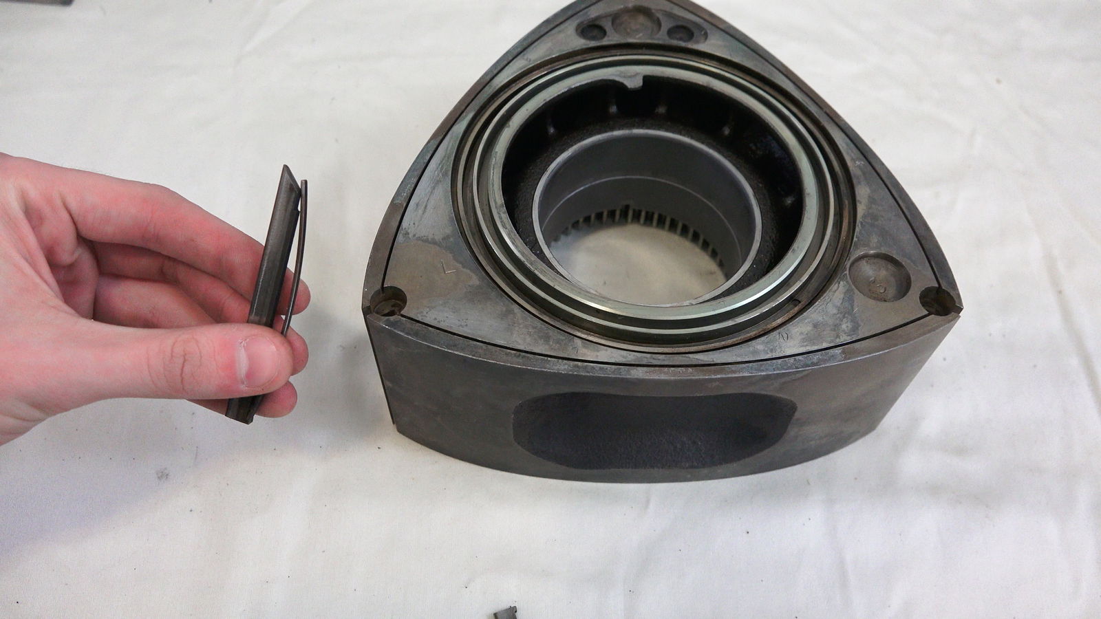 The infamous apex seal from an RX-7 13B rotor