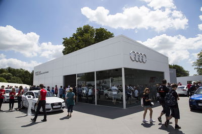 Audi's massive stand had a long walkway flanked by cars, leading to an extensive open-air showroom with its own viewing area of the hill climb