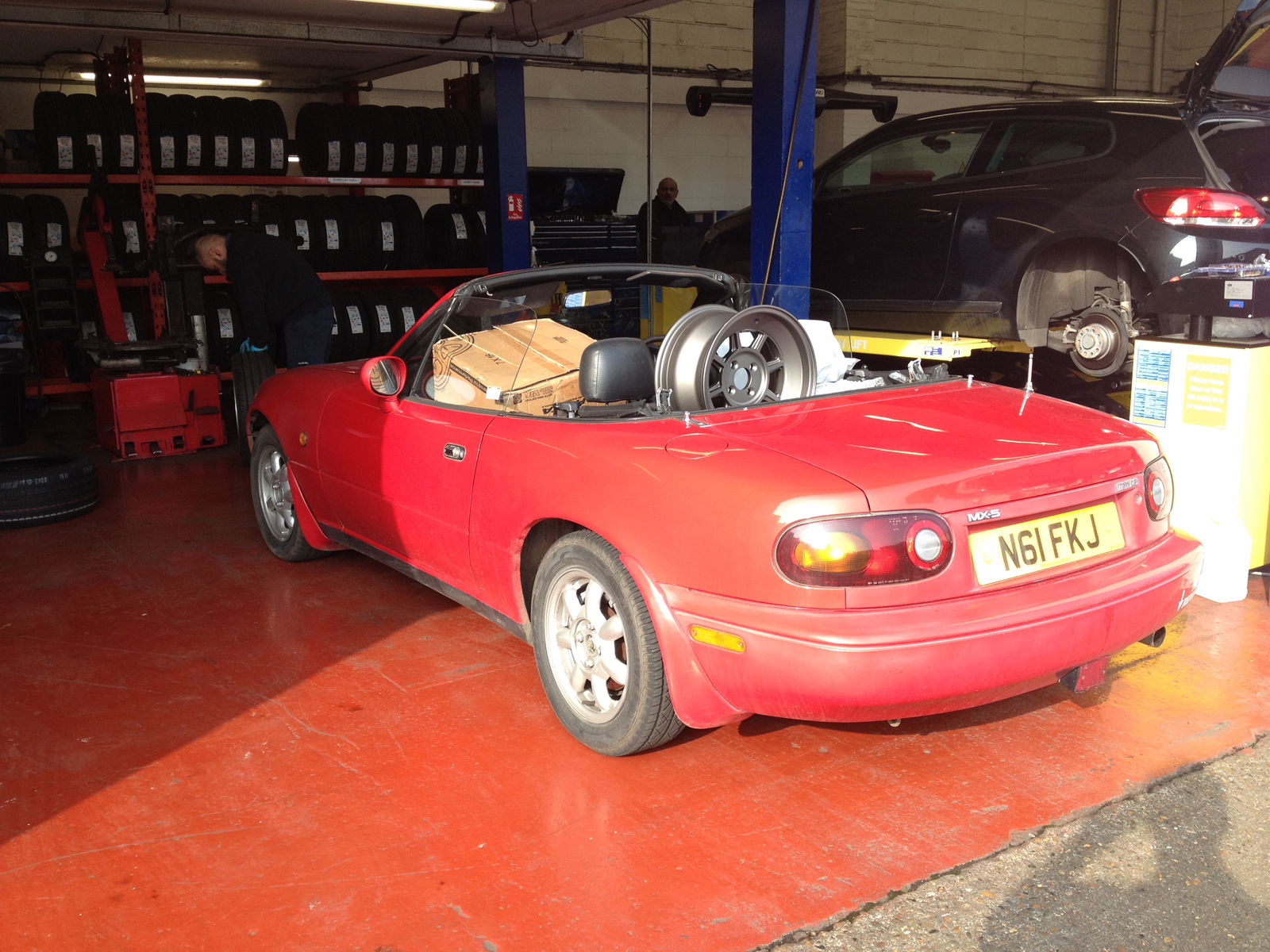 The MX-5 arrives at Kwik Fit to have its new wheels and tyres fitted