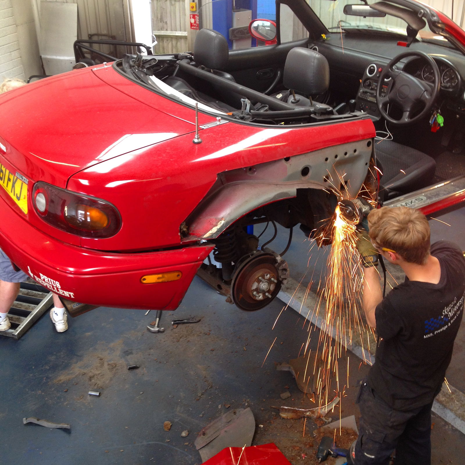 Skuzzle employee Marc grinds out original panels to reveal the massive rust issues