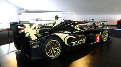 The Lotus LMP P1/01 Race Car Is A Black And Gold Beauty