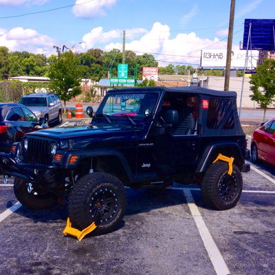 Park Like This In Atlanta And You'll Get A Clamp For Every Space You Take Up 