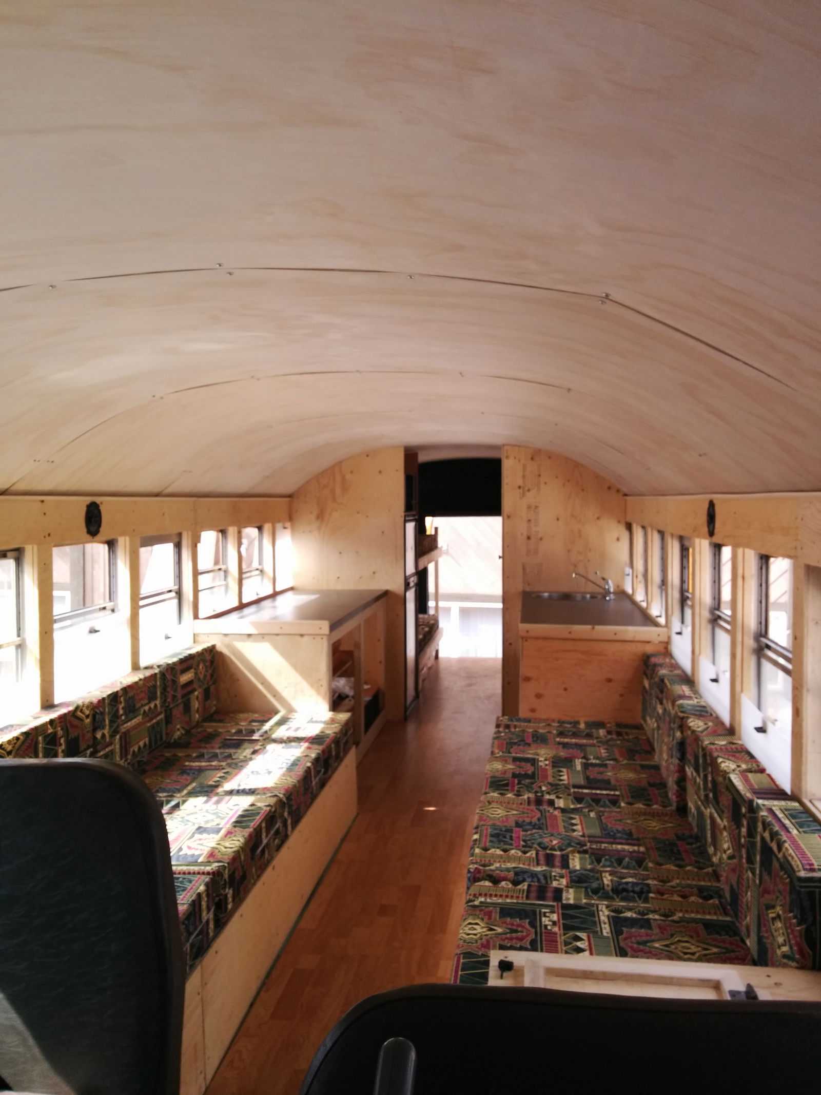 The complete lounge and kitchen, with bunk beds in the rear.
