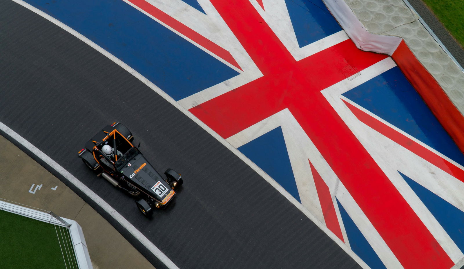 Look closely, and you'll see something's not right with this Caterham's front suspension... (Image via Altitude Media)