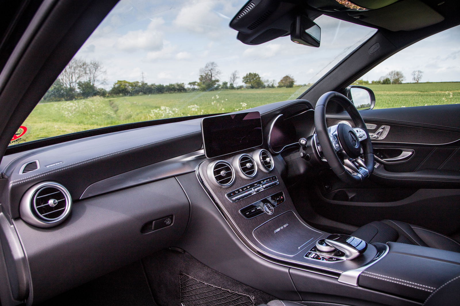 Other than the AMG badge on the cupholder lid of the V8 cars, you'll struggle to spot many differences between the C43 and 63 cabins