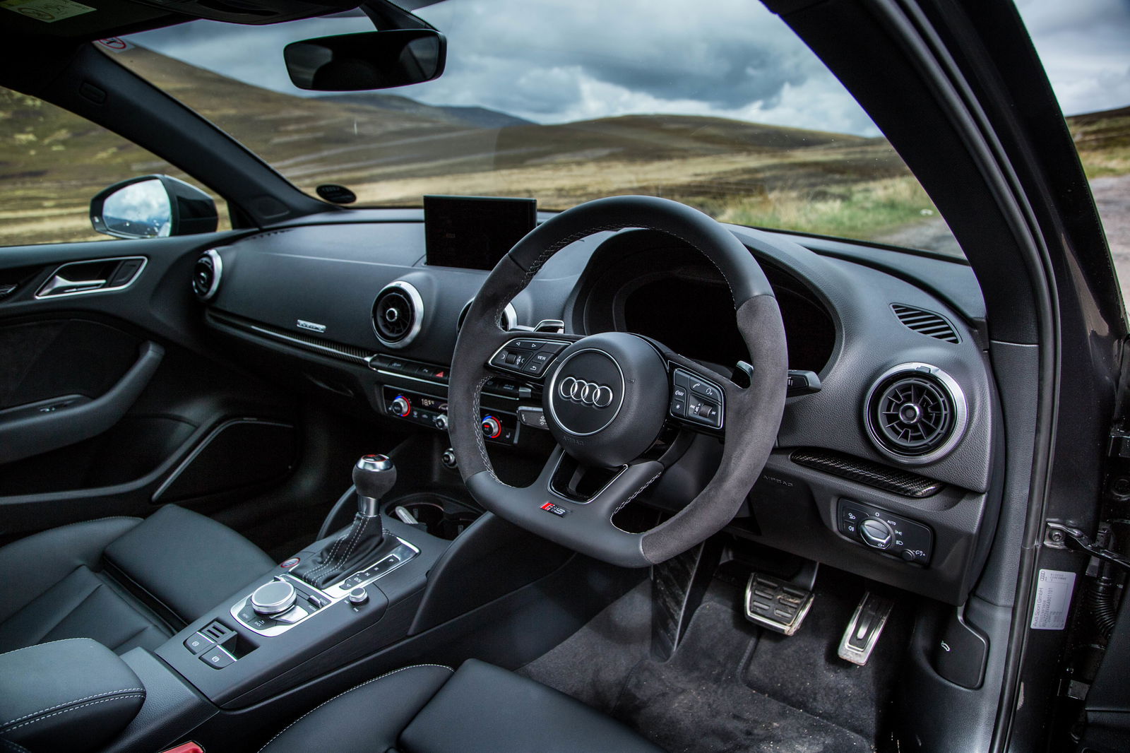 The Audi RS3's cabin is starting to show its age, but it's still a brilliant lesson in classy understatement