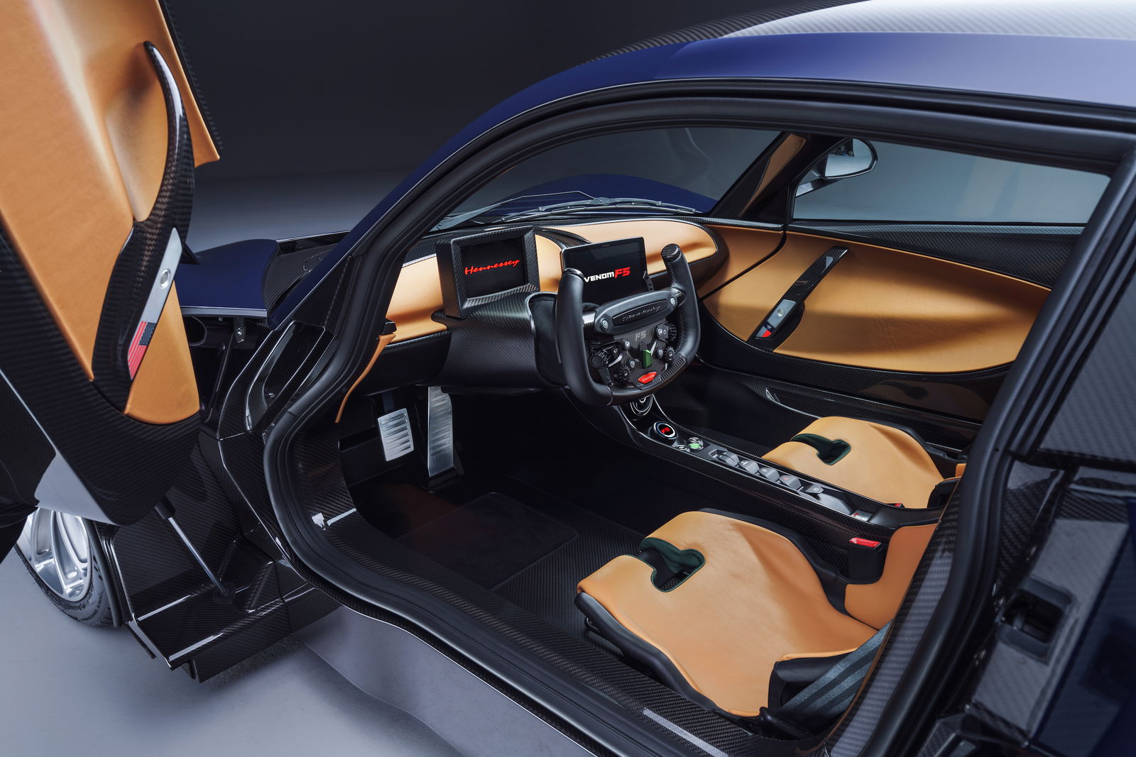 The F5's steering wheel is inspired by what you find in F1 cars, and also aircraft yokes