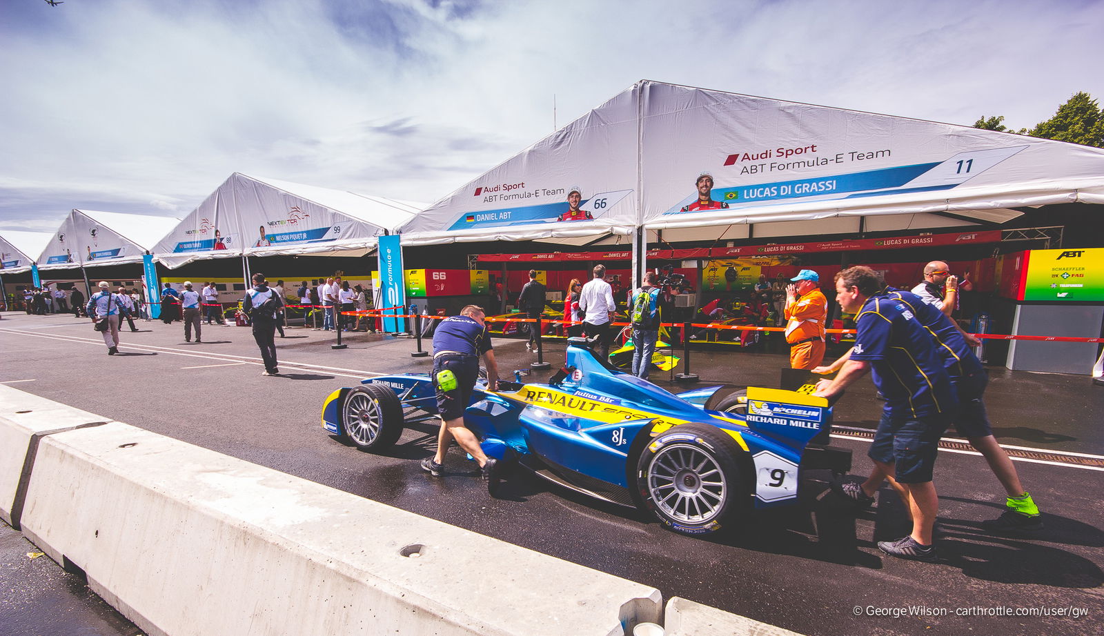 Sebastian Buemi's e.dams Renault is wheeled down the pit lane
