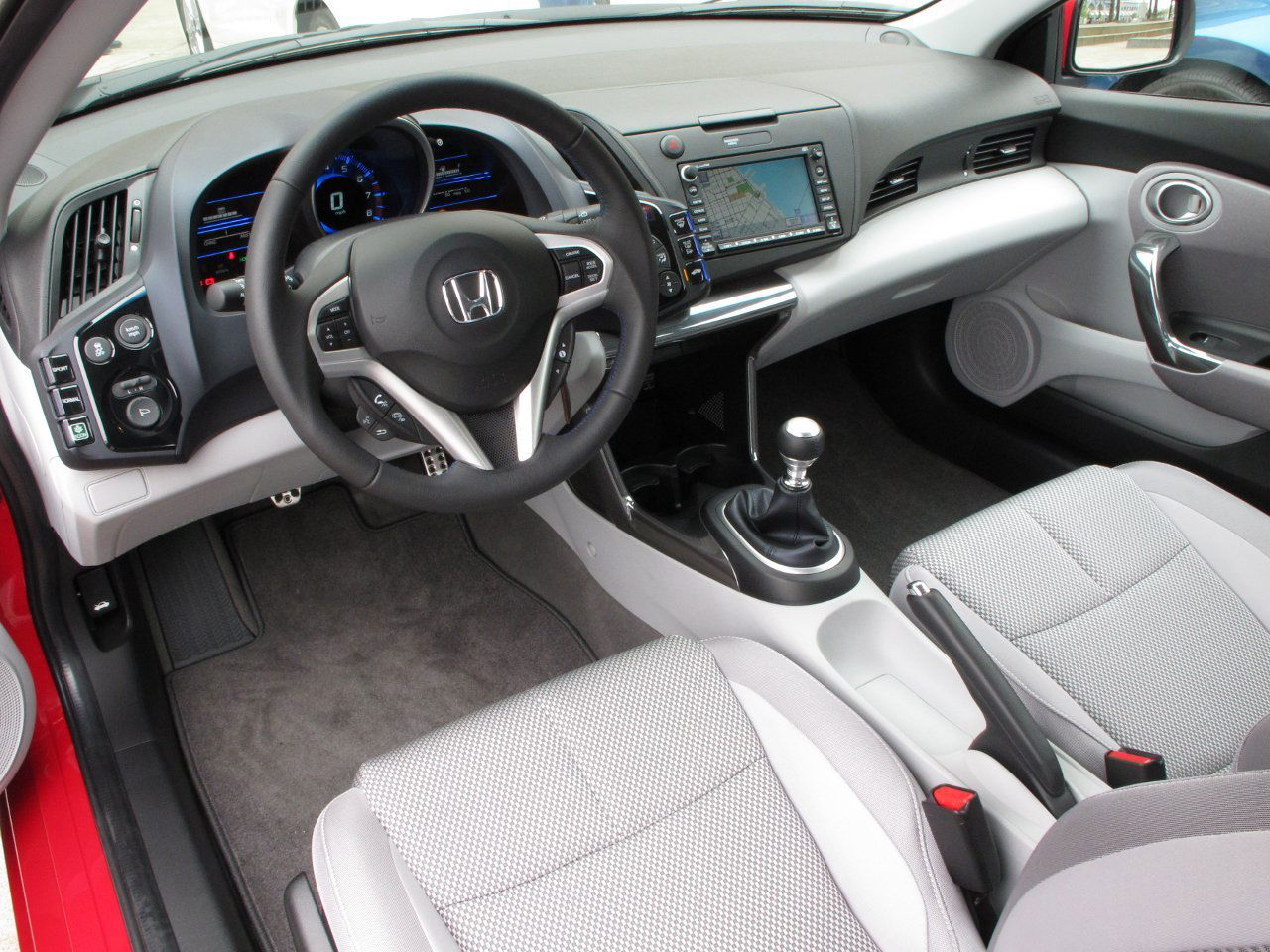 The interior is pretty typical for a Honda, although the lack of a centre armrest is annoying.