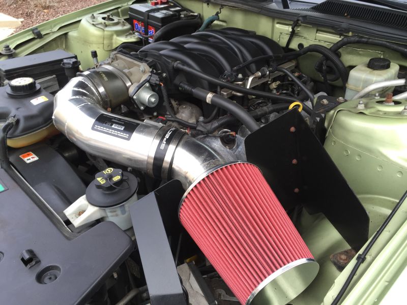 The old air filter that was on the car was in awful shape, so this shiny pod filter replaced it on the Spectre intake