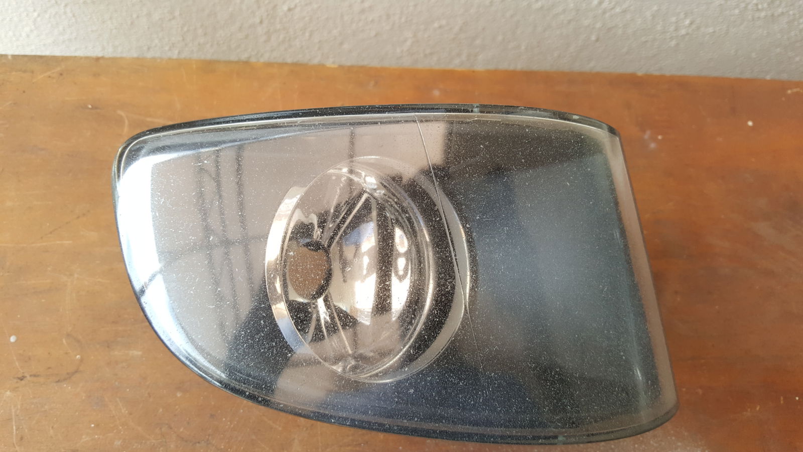 One of the fog lights before restoration