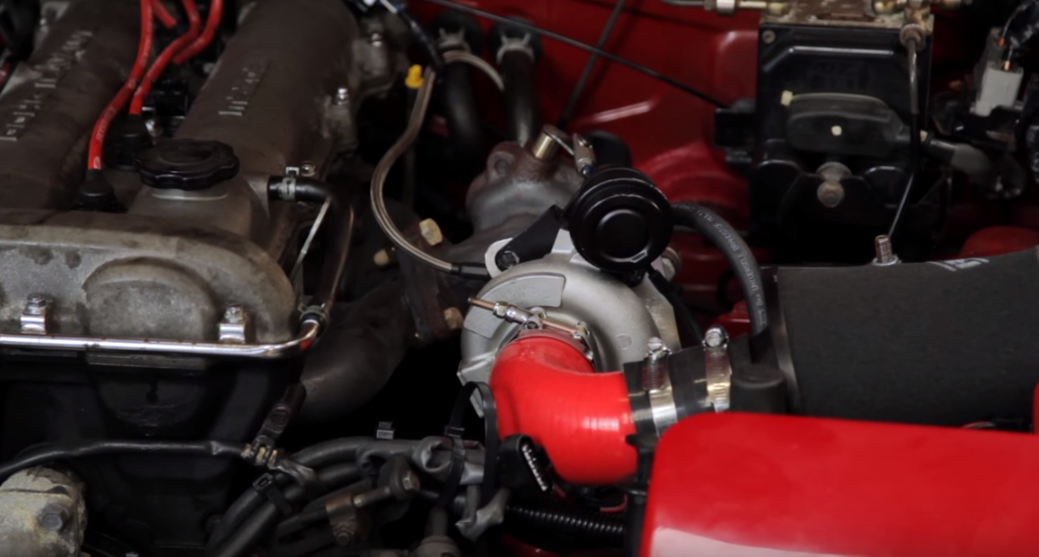 A traditional turbocharger placement on Phil, snug to the engine block