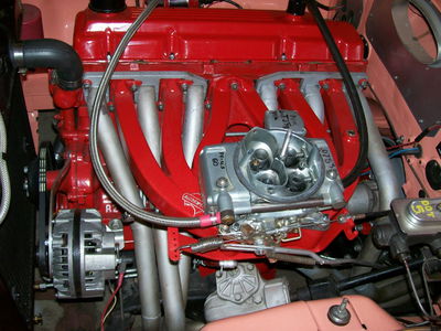 Here you can clearly see the intake and exhaust ports and manifolds in the silver and red colours