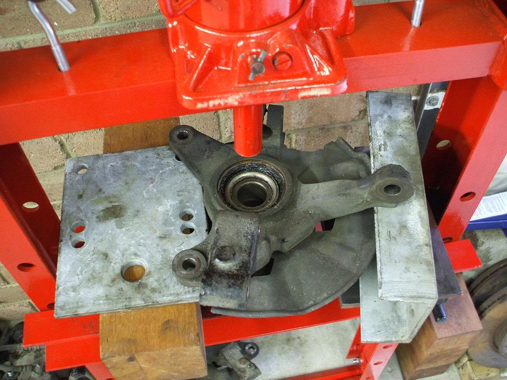 A hydraulic press is the surefire method to insert a new wheel bearing