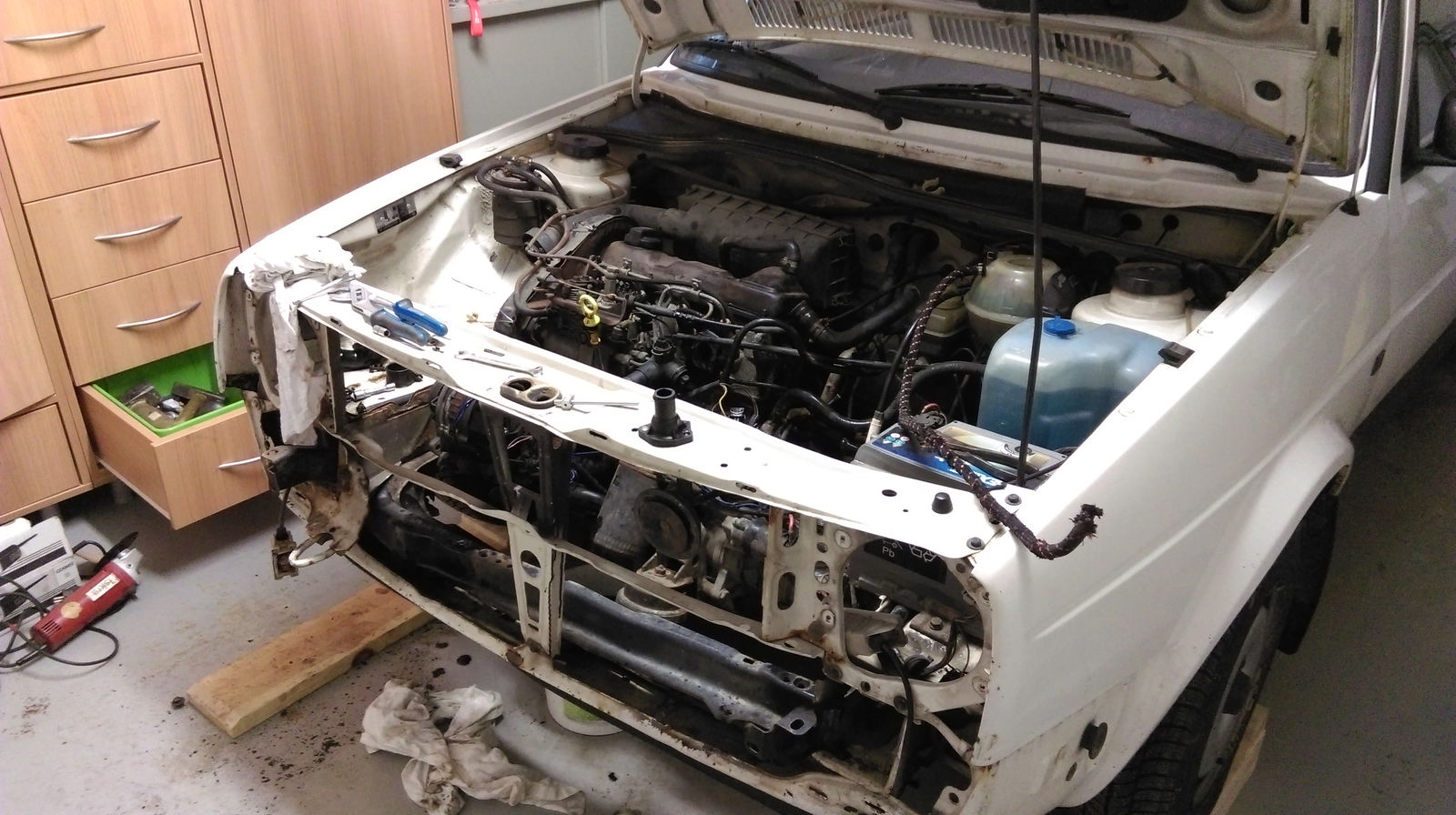 Changing the thermostat and ended up taking the whole front end apart.