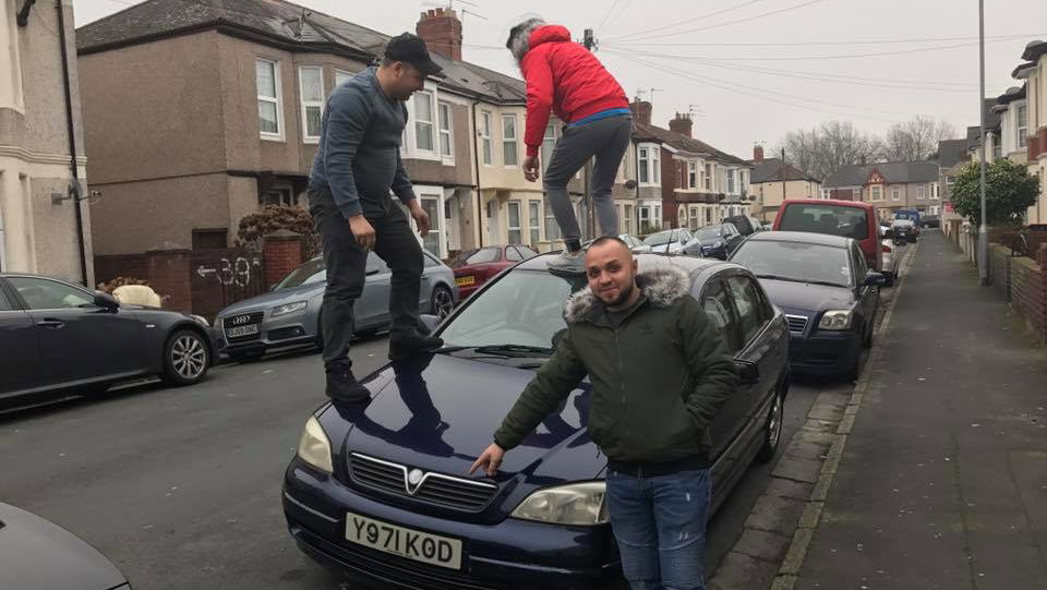 This Man Wants To Sell You A Vauxhall Astra That His Friends Are Standing On