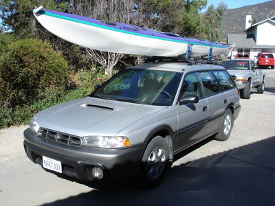 Not my car, but similiar set up. Older boat, with bungy cords and ratcheting tie down roaps. Source: https://www.flickr.com/photos/gregmote/170266581/in/photolist