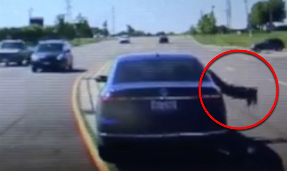 Watch The Moment A Brave Bystander Jumped Into A Moving Car To Stop An Accident