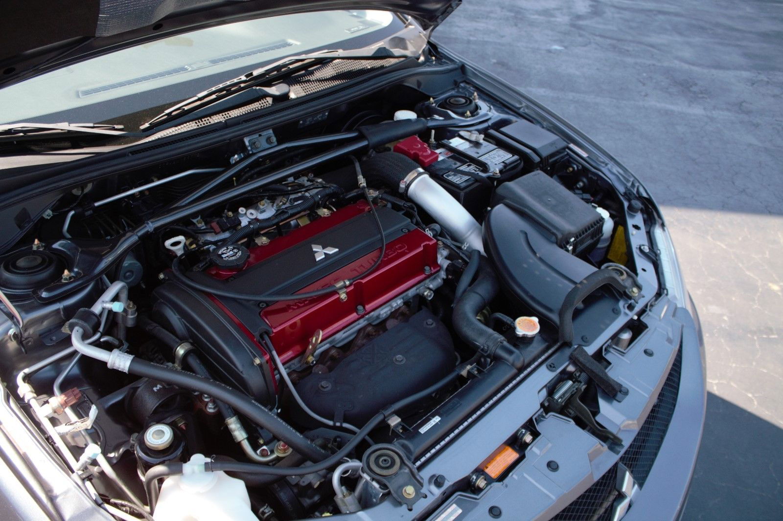 This 'Brand New' 11-Year-Old Mitsubishi Evo IX Is Somehow Attracting Six-Figure Bids