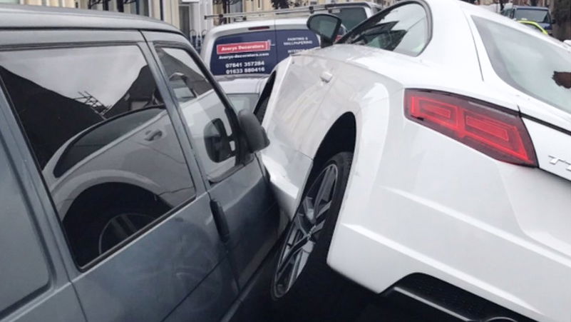 Here's An Audi TT Parked On Two Other Cars For Some Reason
