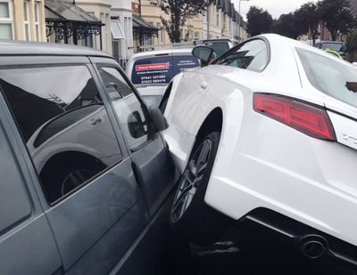 Here's An Audi TT Parked On Two Other Cars For Some Reason