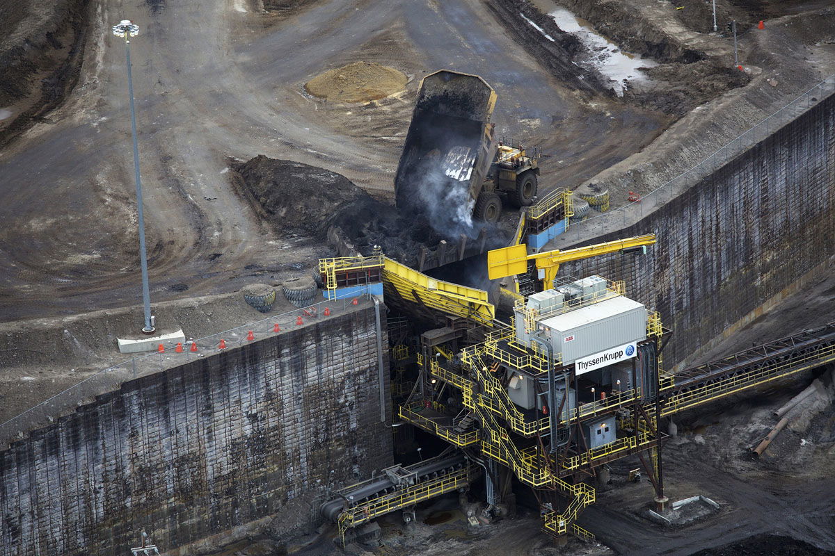 The extraction of oil sands in Alberta, Canada.