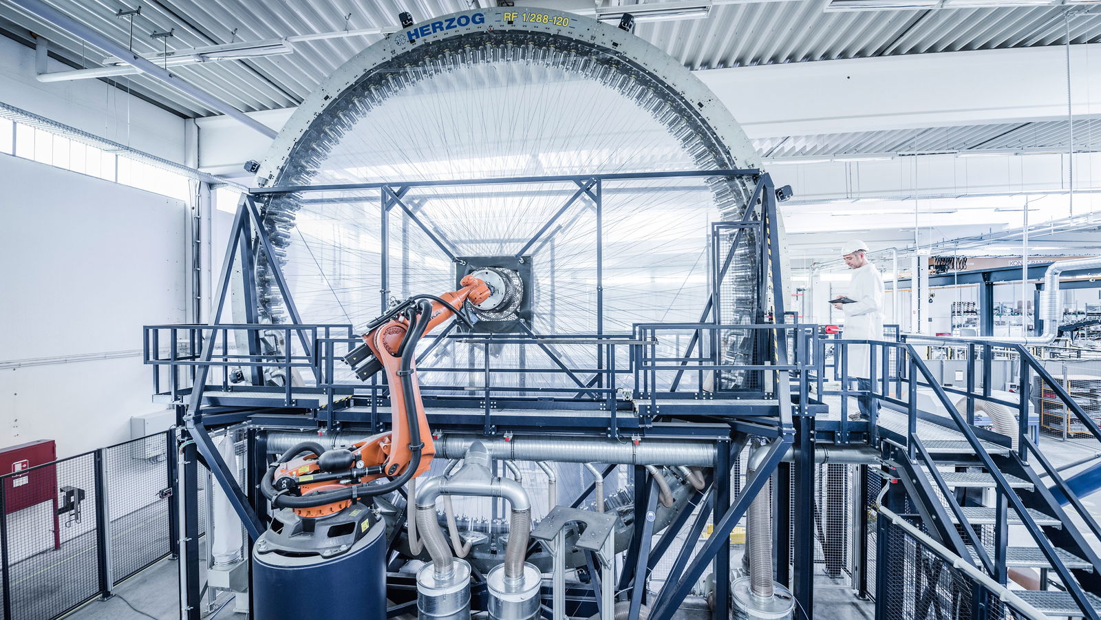The carbonfibre braiding machine, measuring nine metres wide