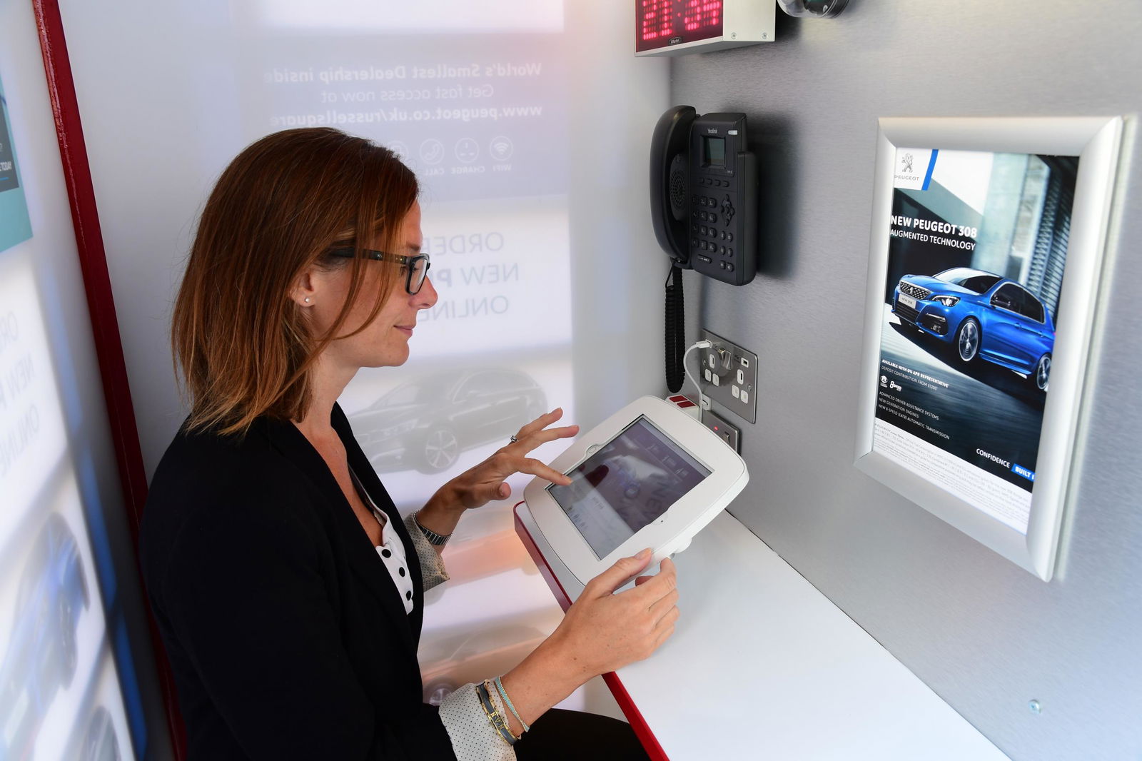 The Smallest Car Dealership In The World Is Launching Inside A Phone Booth