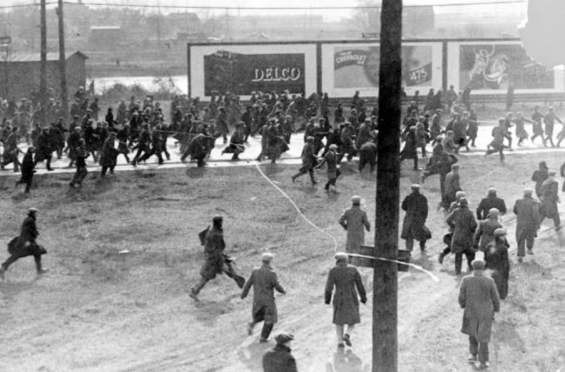 Protesters running away after the first shots were fired.