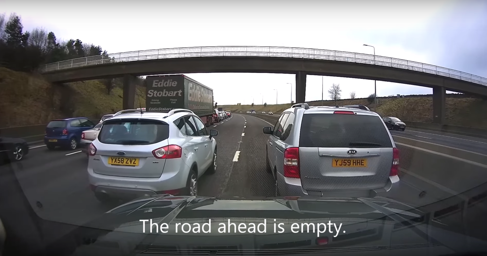 Watch Two Idiot Drivers Block Half A Motorway For No Damn Reason