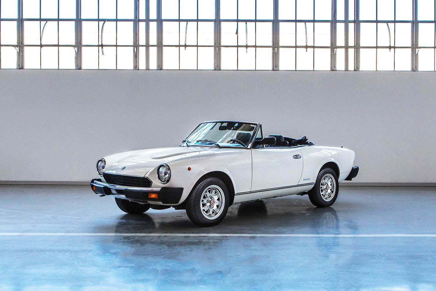 One of the later versions of the Fiat 124 Spider. This one has just 10,000km on the clock