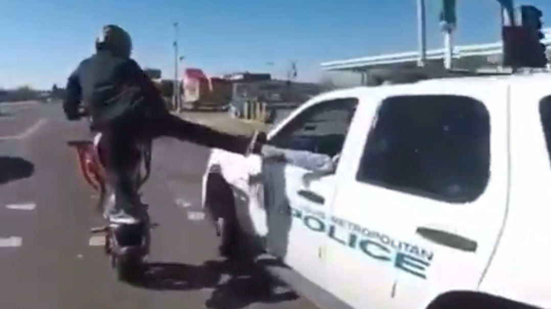 This Super-Friendly Cop Fist-Bumps A Wheelying Biker