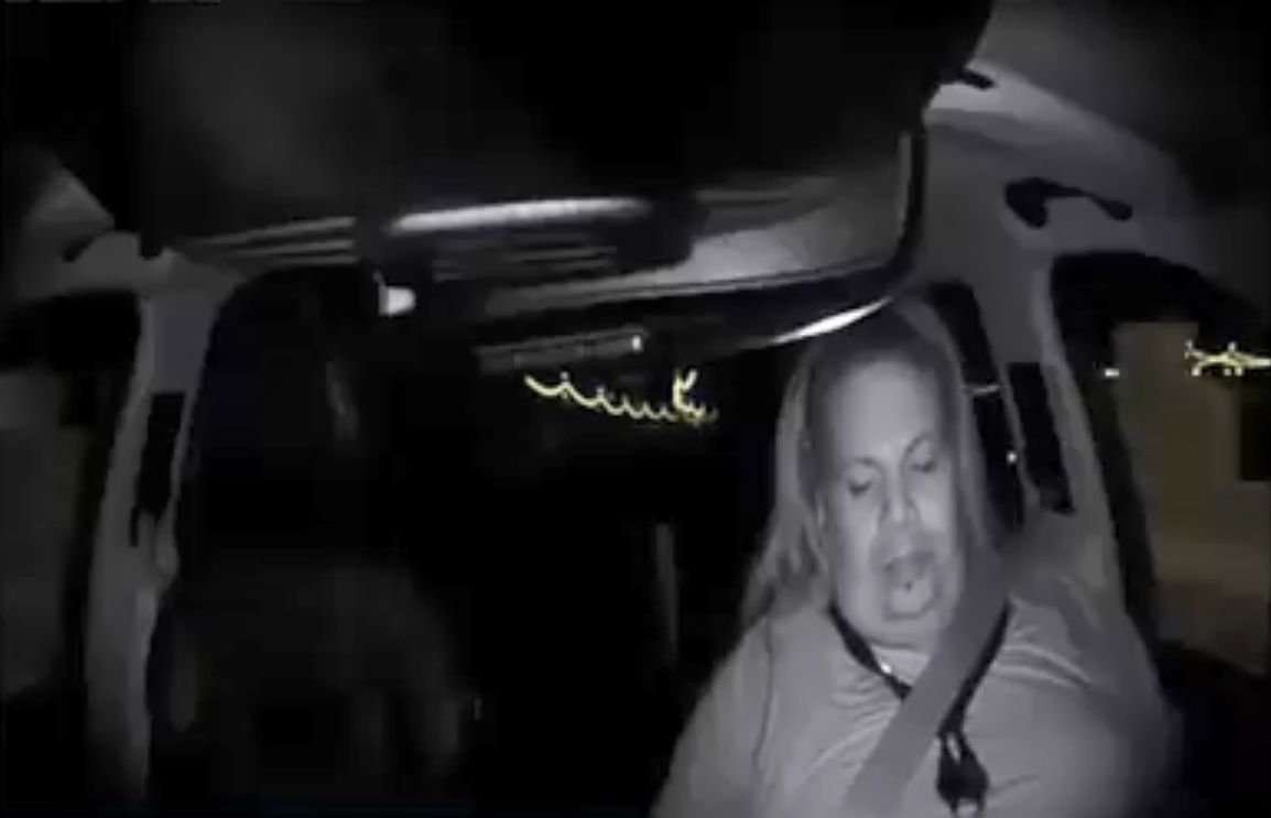 The backup driver spends long moments looking downwards, away from the road
