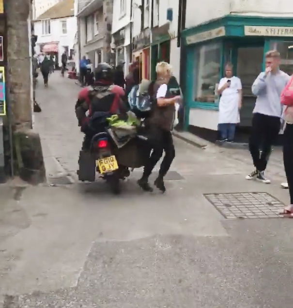This Moped-Riding Lunatic Hit Cars And People In A Bizarre Urban Clash