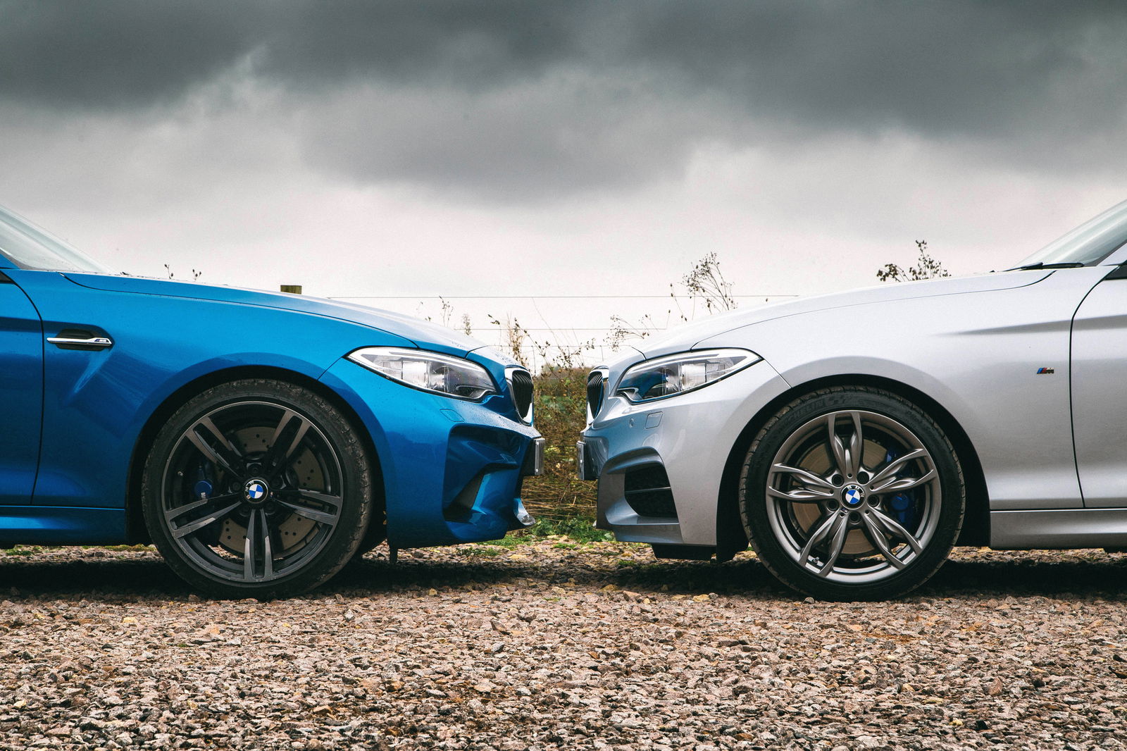 A BMW M2 with drilled discs faces off with an M240i sporting flat-faced ventilated items