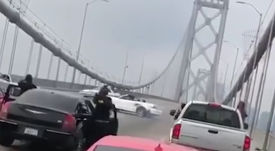 San Franciso Bridge Traffic Brought To A Halt By Mustangs Doing Donuts