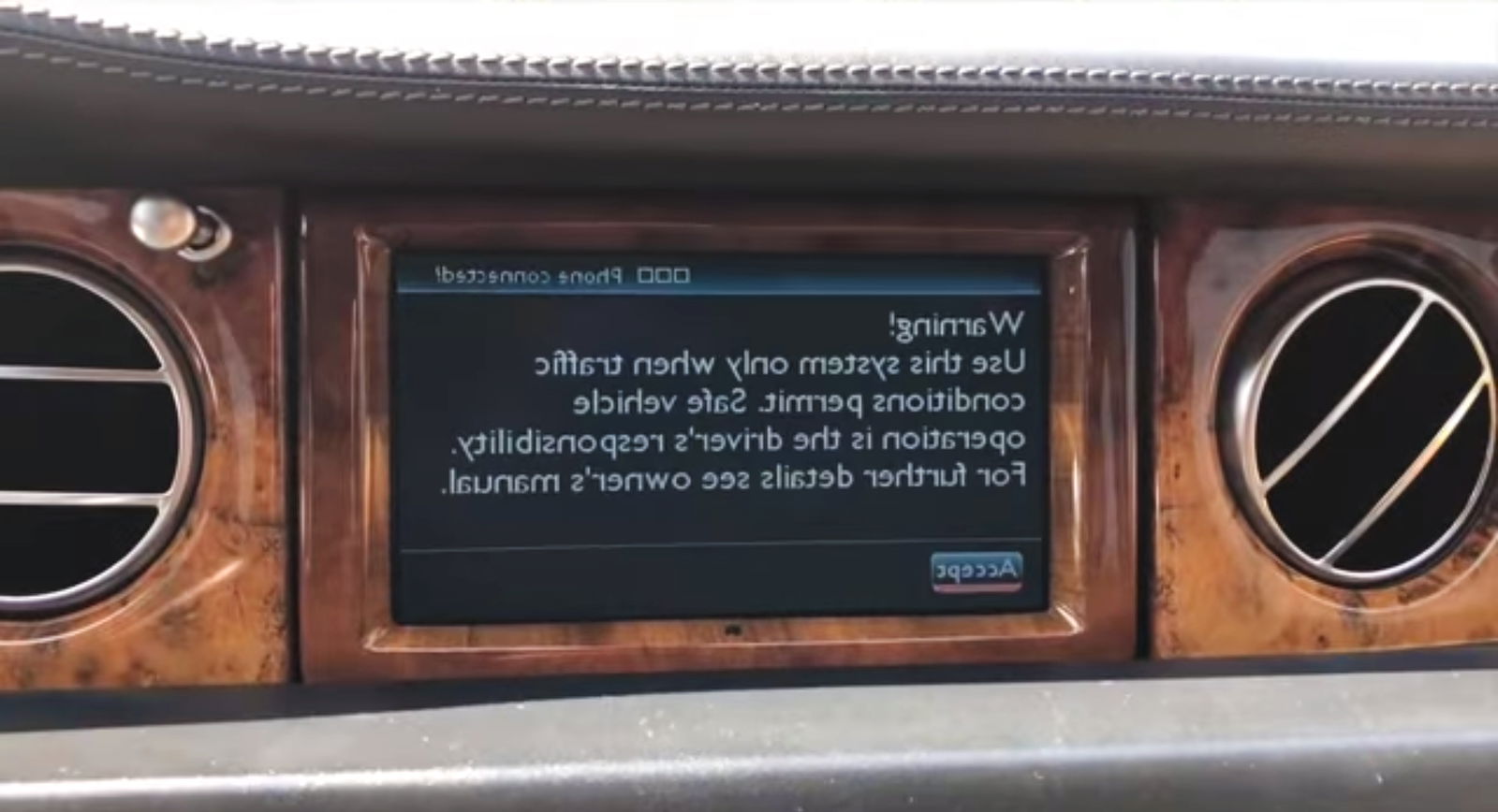 The glitchy iDrive display rapidly flickers vertically and horizontally...