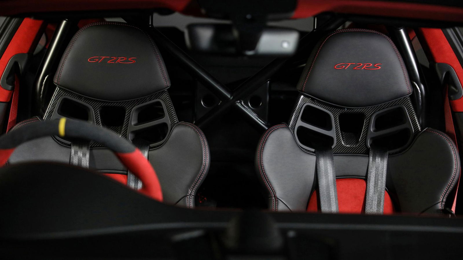 The steel roll cage with bucket seats and harnesses